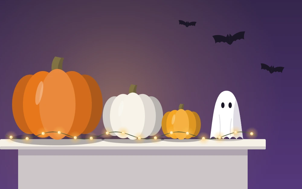 One end of a mantel with three pumpkins, a small ghost figure and tiny warm lights
