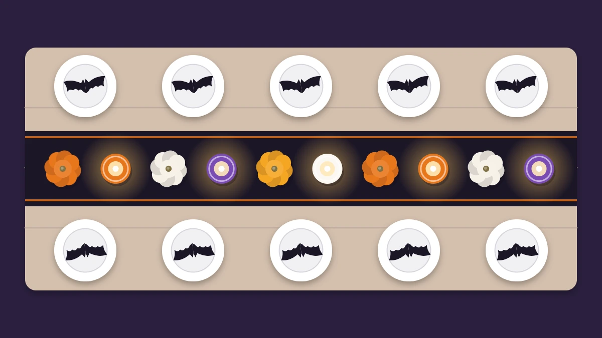 Long party table from above with a black runner, small pumpkins, jar lanterns and plates topped with paper bats