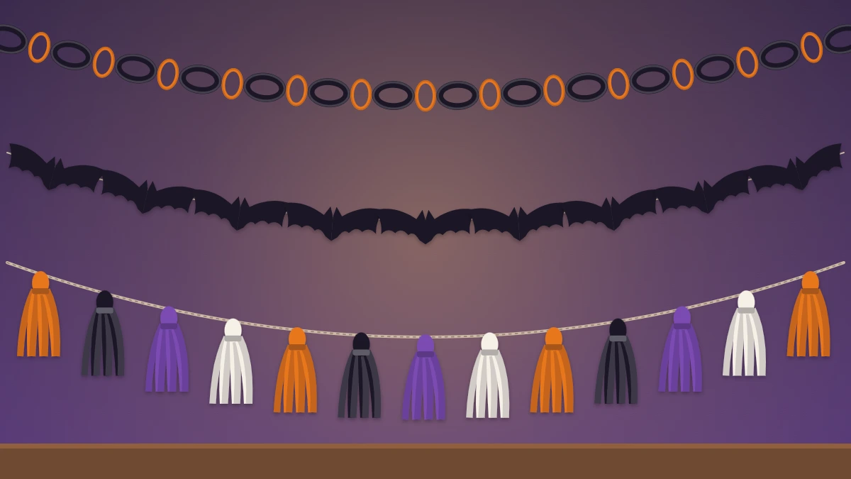 Three paper garlands layered on a wall: a black and orange chain, connected paper bats and tissue tassels